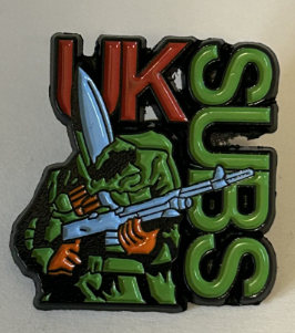 UK SUBS - WARHEAD WITH UK SUBS CUT OUT ENAMEL PIN