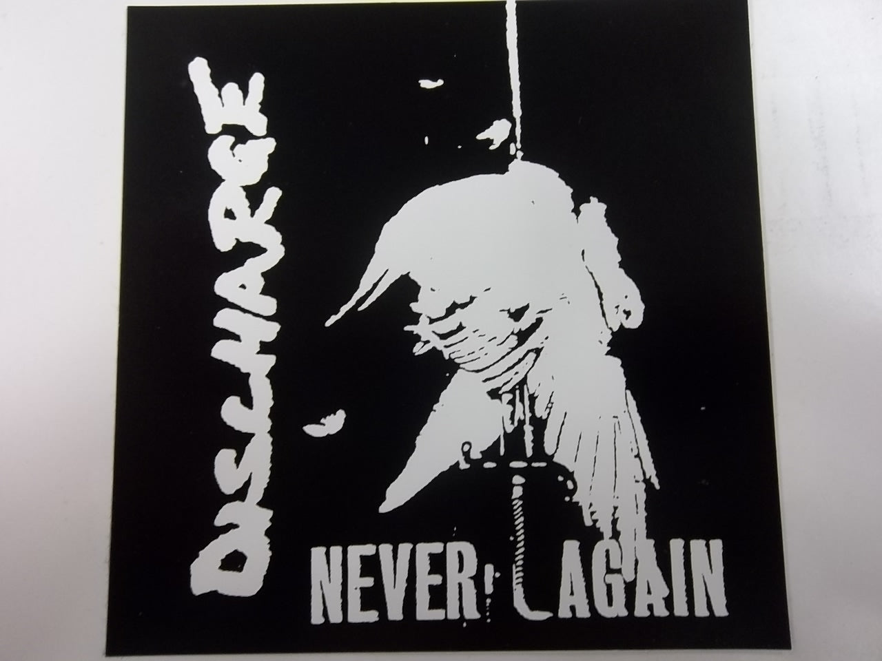 DISCHARGE - NEVER AGAIN STICKER